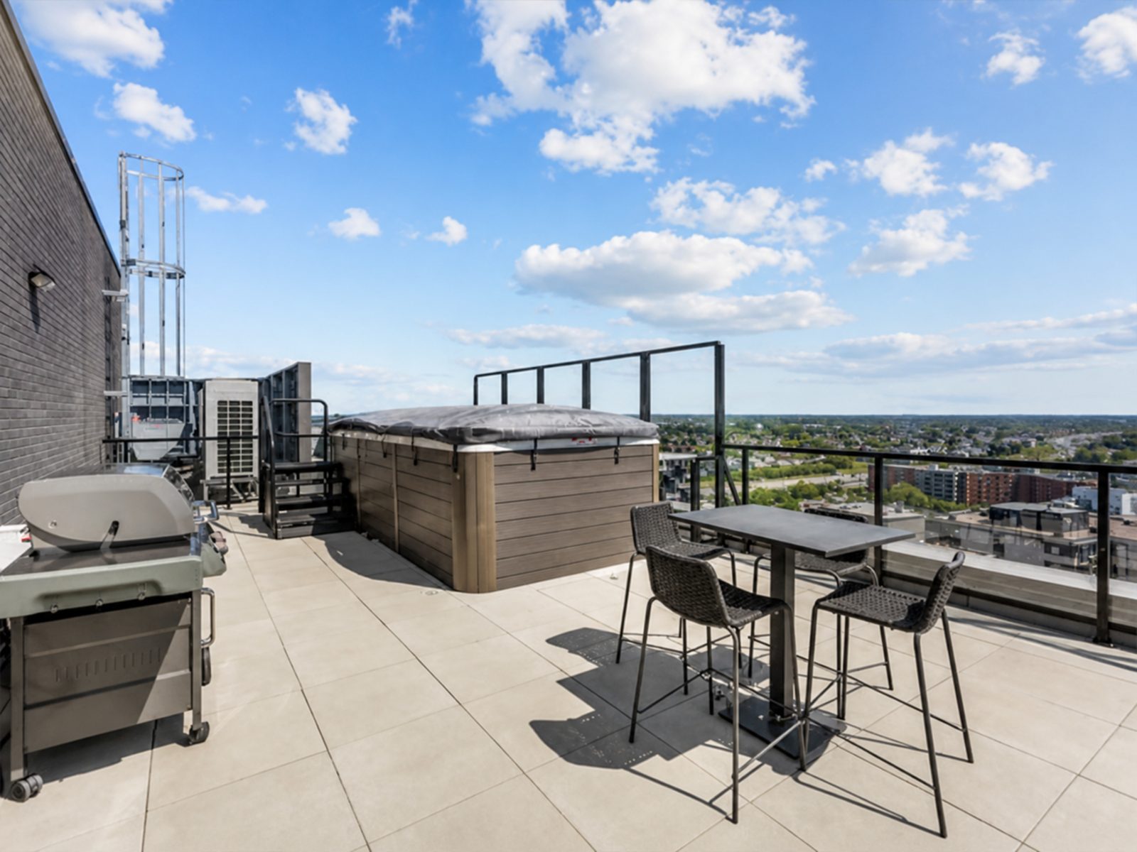 Rooftop terrace with spa and dining area, open views