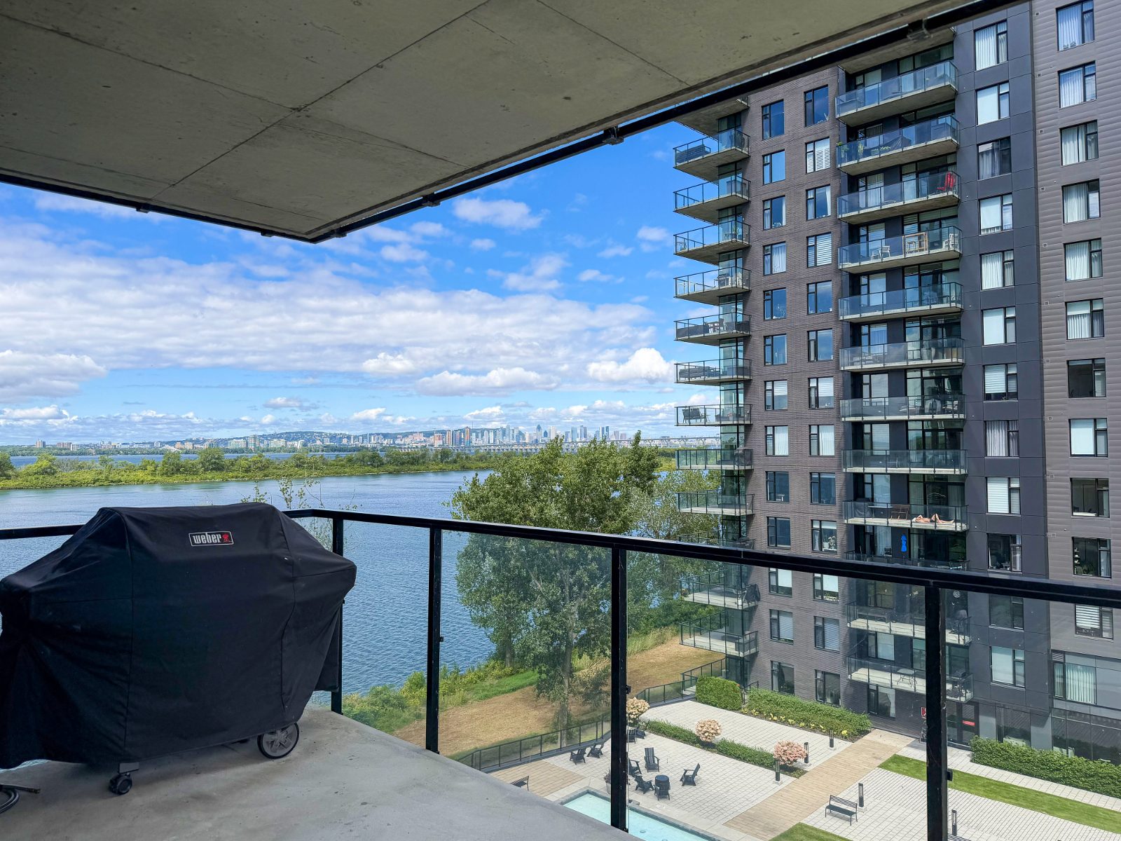 Covered terrace with views of the St. Lawrence River and the Montreal skyline